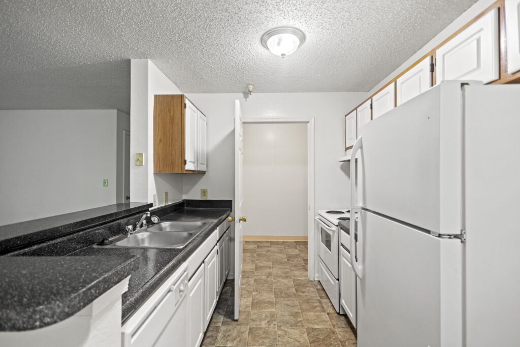 Mallard Cove Apartments Kitchen with laundry room