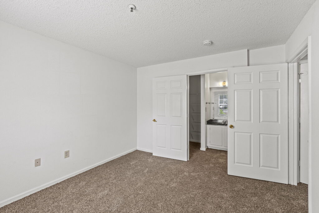 Mallard Cove Apartments bedroom with storage and bathroom