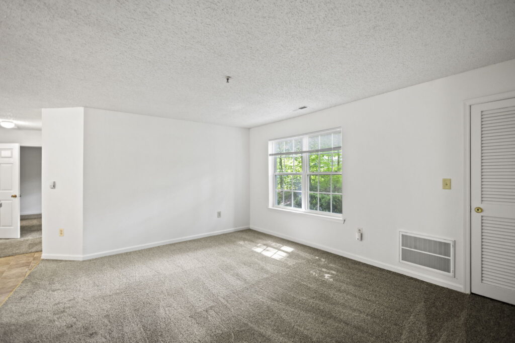 Mallard Cove Apartments living room with storage closet