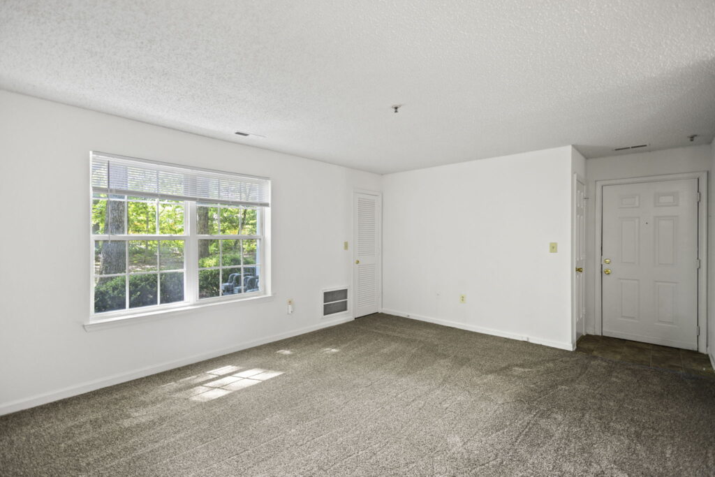 Mallard Cove Apartments living room with woodland view