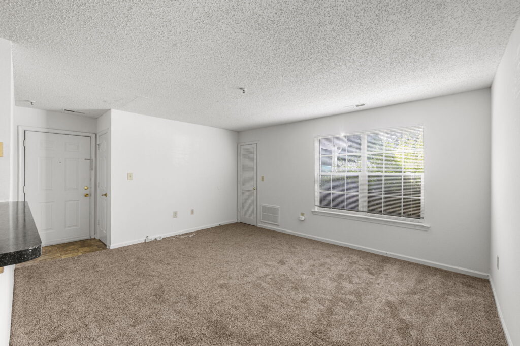 Mallard Cove Apartments living room with closet and view