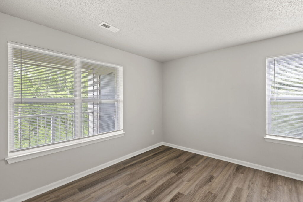 Quartermill Apartments corner of bedroom with balcony view