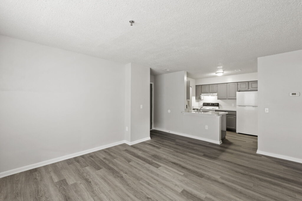 Quartermill Apartments living room with kitchen in